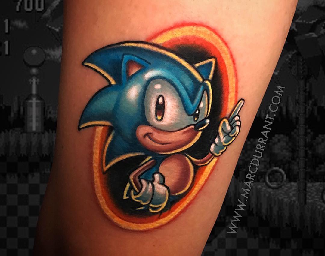 Sonic the Hedgehog illustrative tattoo on the forearm by ᴍᴀʀᴄ ᴅᴜʀʀᴀɴᴛ, Los Angeles, California