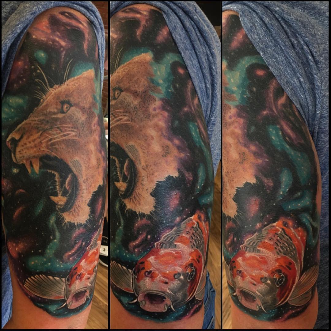 Lion and koi fish realism tattoo on the upper arm by Kody Miller Tattoos 📍Kansas City MO Tattoo, Kansas City, Missouri