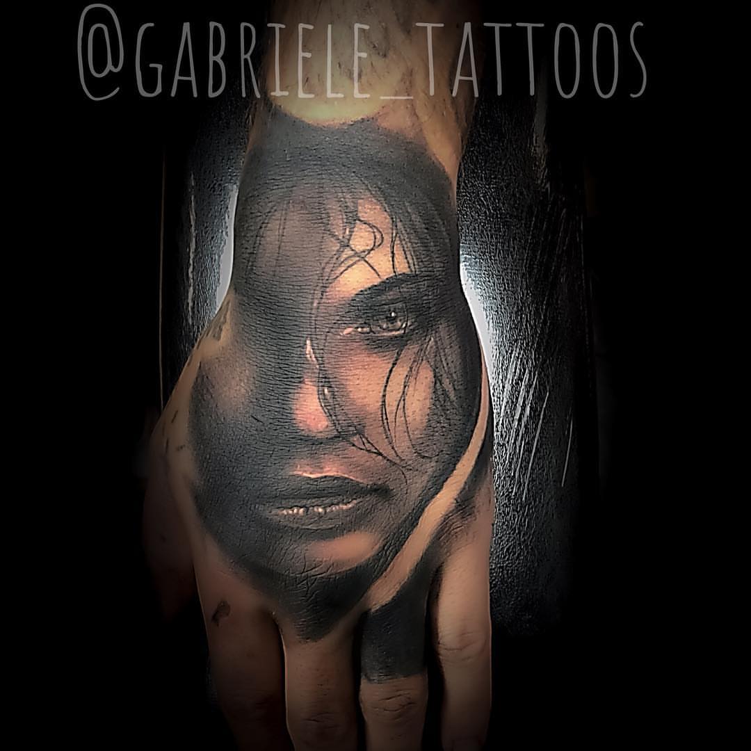 Woman's face realism tattoo on the hand by GABRIELExTATTOOS