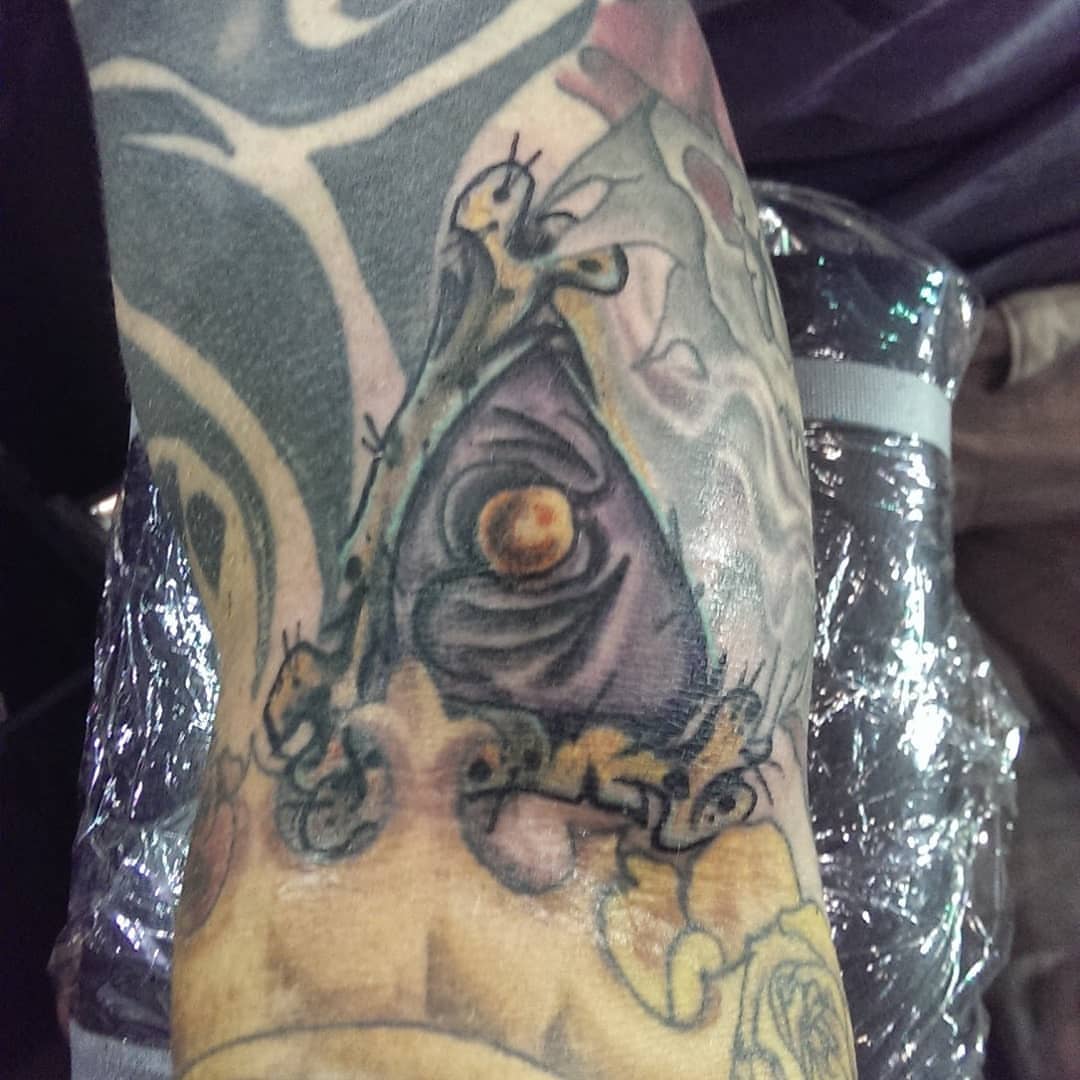 Eye and insects neo-traditional tattoo on the forearm by Rue McLean