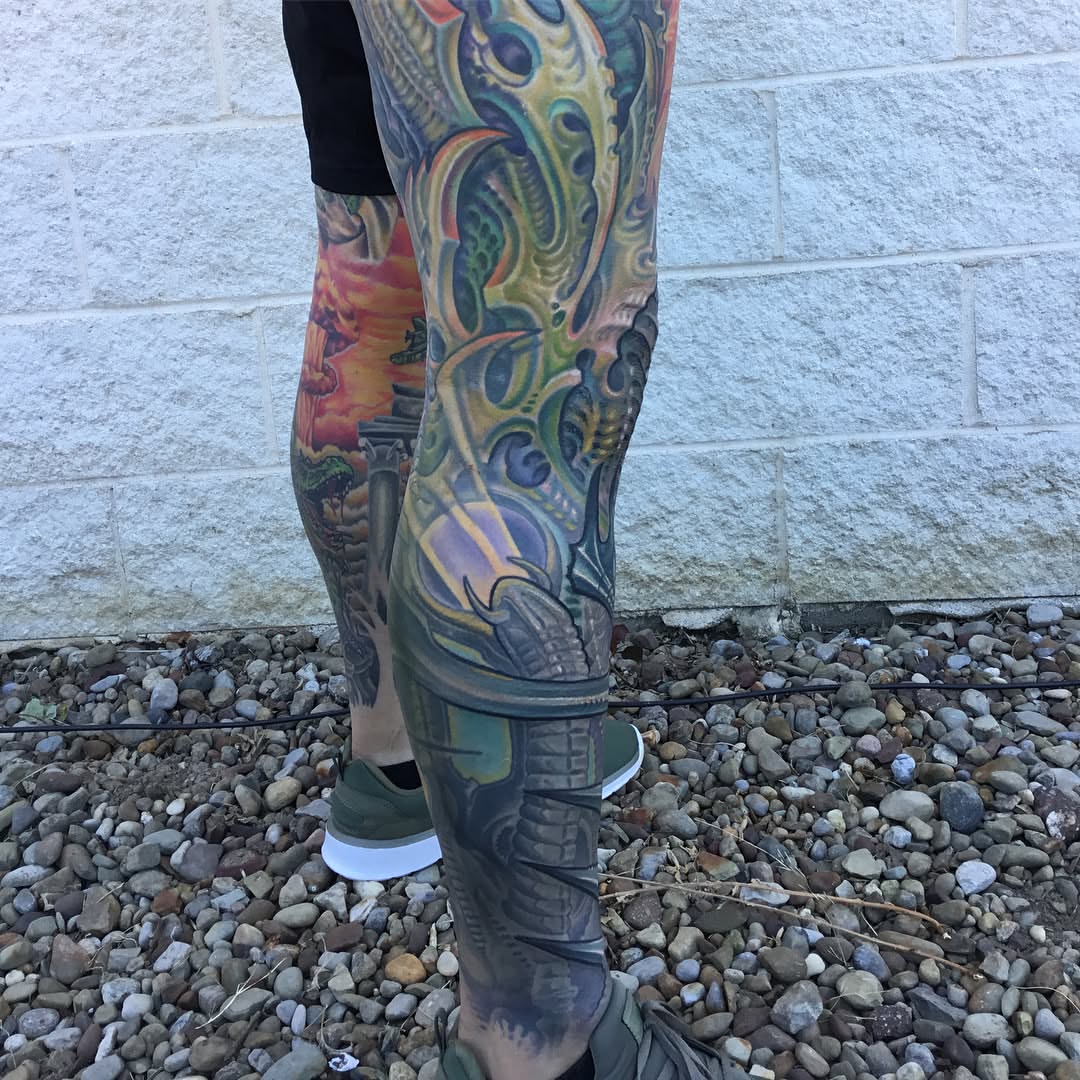 Biomechanical creature new school tattoo on the leg by Phil Robertson