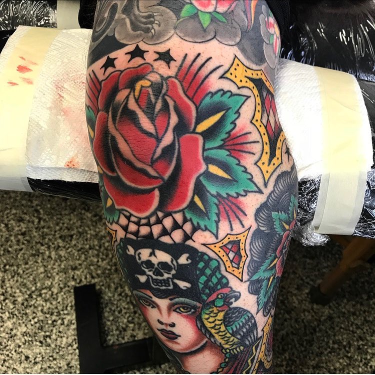 Rose and woman American traditional tattoo on the thigh by Dave G