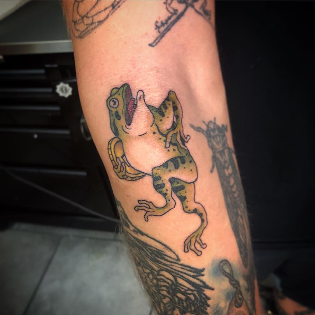 Frog new school tattoo on the forearm by Michigan Tattoo Artist