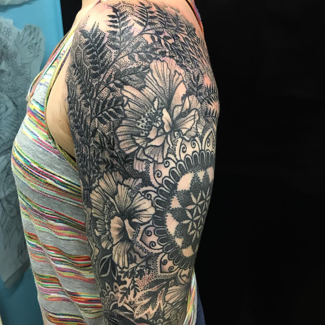 Floral mandala dotwork tattoo on the upper arm by Steven Campbell, Kansas City, Missouri
