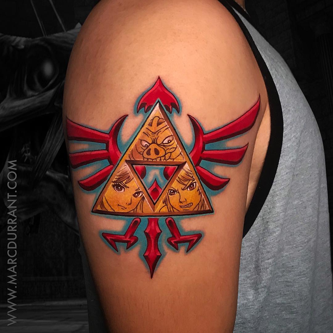 Triforce geometric tattoo on the shoulder by ᴍᴀʀᴄ ᴅᴜʀʀᴀɴᴛ, Los Angeles, California