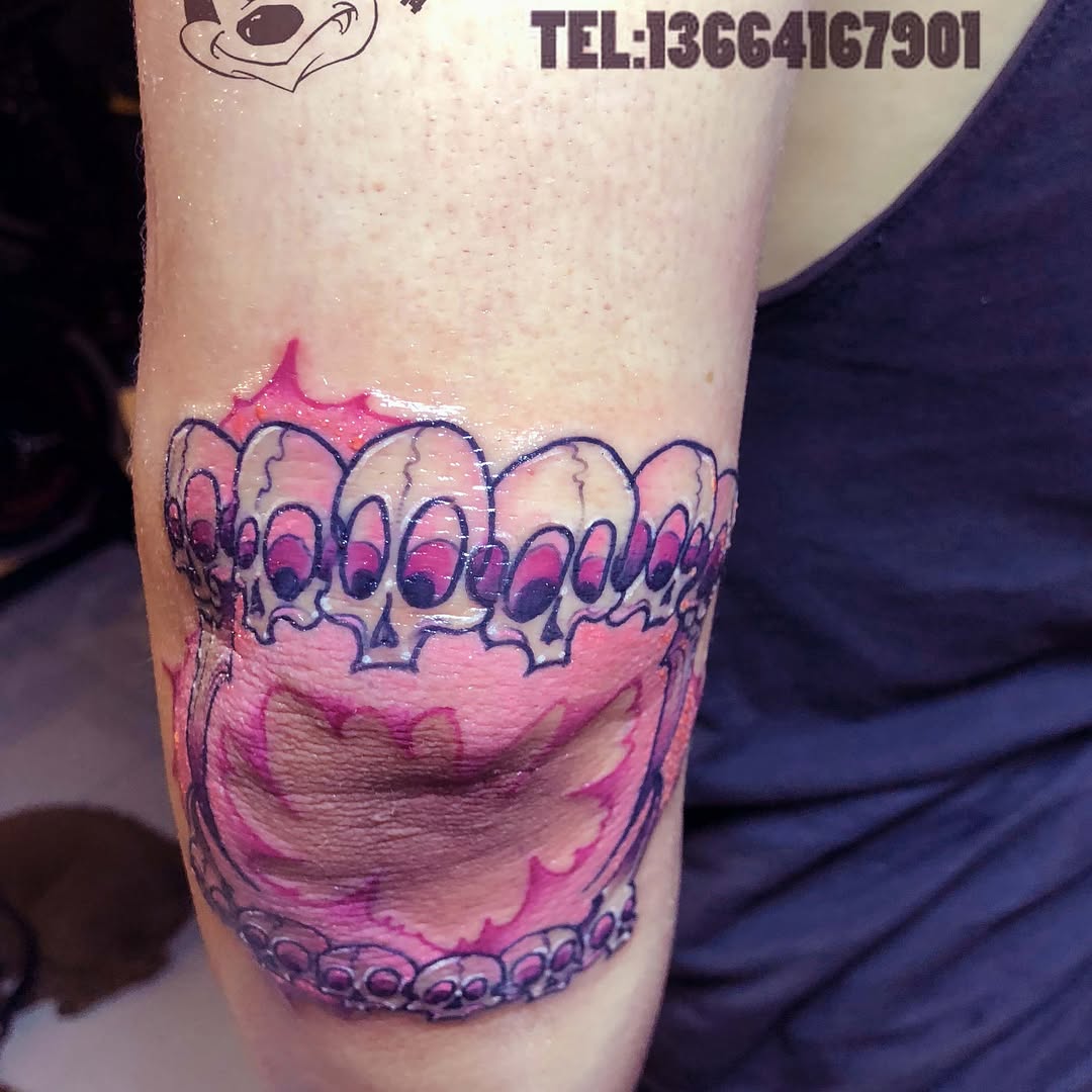 Row of skulls tattoo on the forearm by 中国🇨🇳沈阳513TATTOO