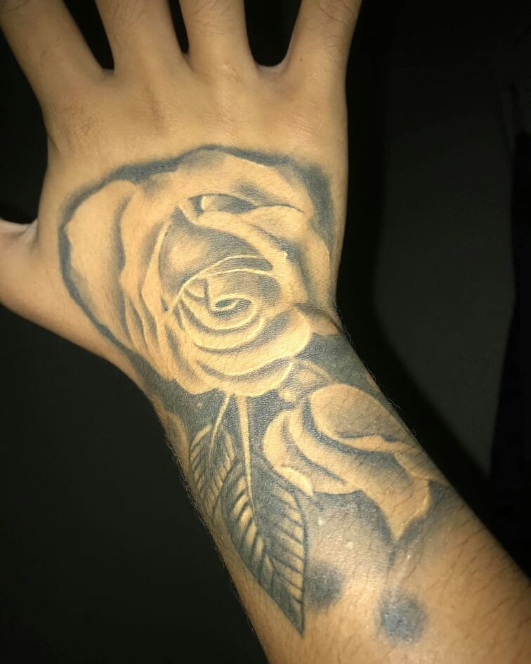 Rose black and grey tattoo on the hand by Bree Quirino