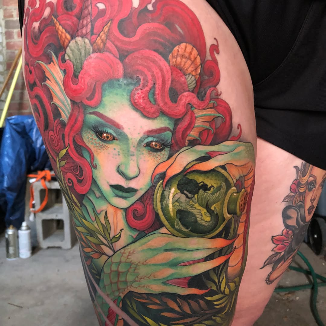 Mermaid new school tattoo on the upper arm by Erin Chance