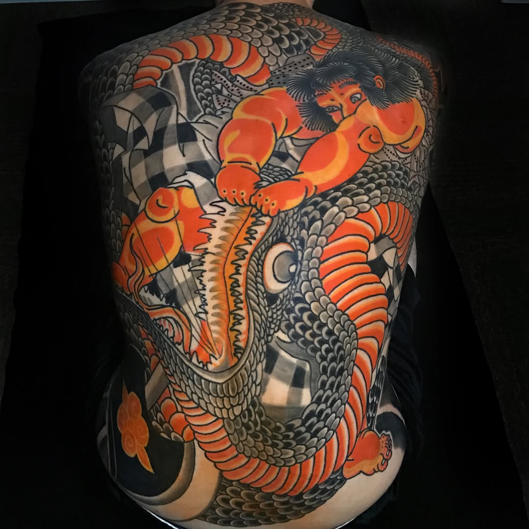Man fighting a snake Japanese tattoo on the back by Jhon