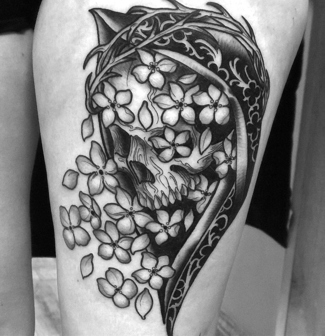 Flower skull realism tattoo on the thigh by Sam Fortney, Columbus, Ohio