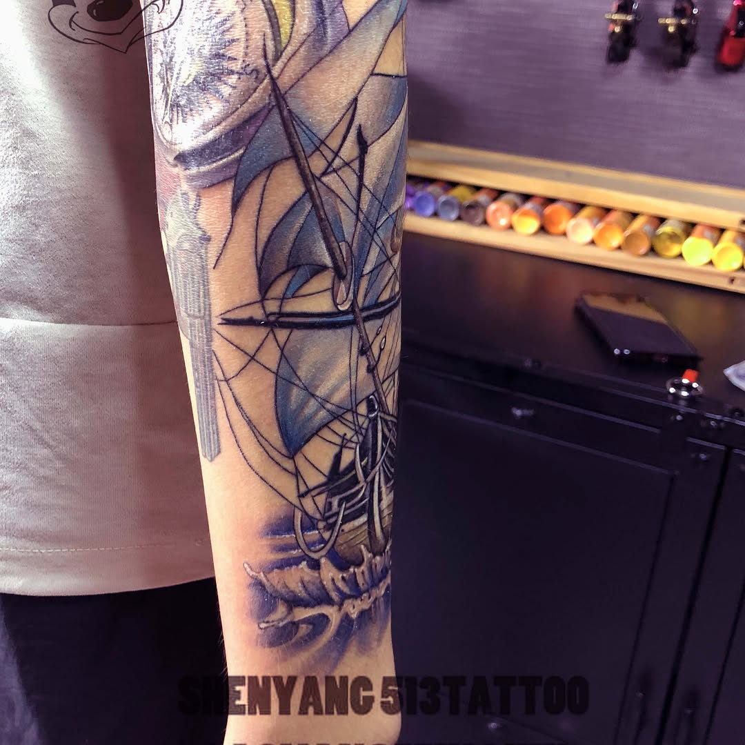 Sailboat on waves tattoo on the forearm by 中国🇨🇳沈阳513TATTOO