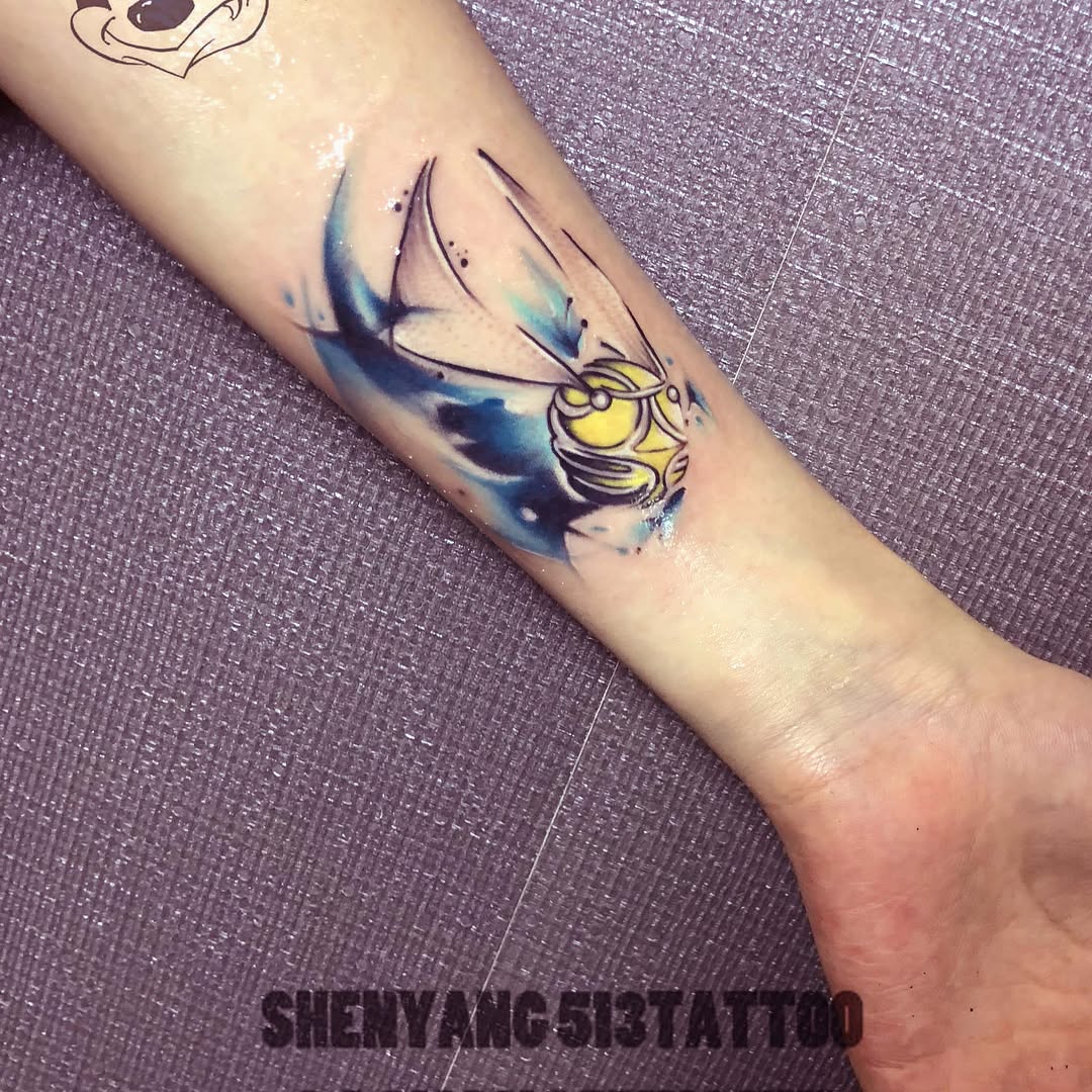 Golden snitch tattoo on the forearm by 中国🇨🇳沈阳513TATTOO
