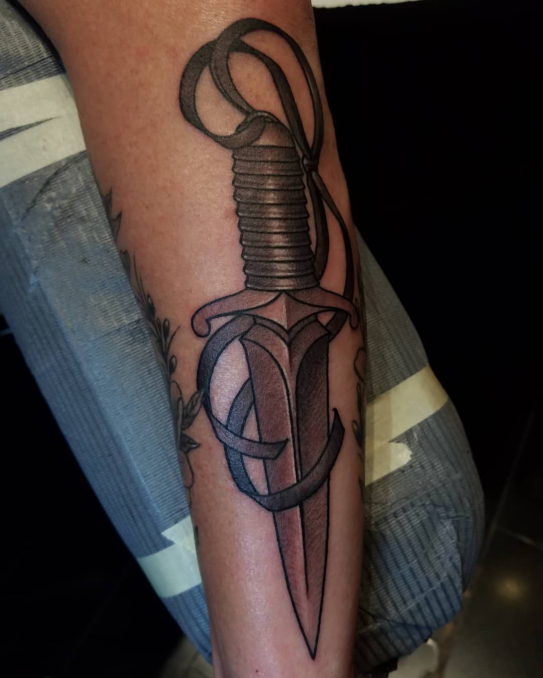 Sword black and grey tattoo on the forearm by @jaclyngreb