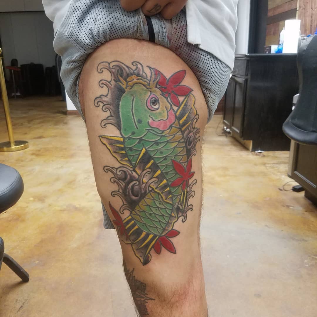 Koi fish American traditional tattoo on the thigh by Rue McLean