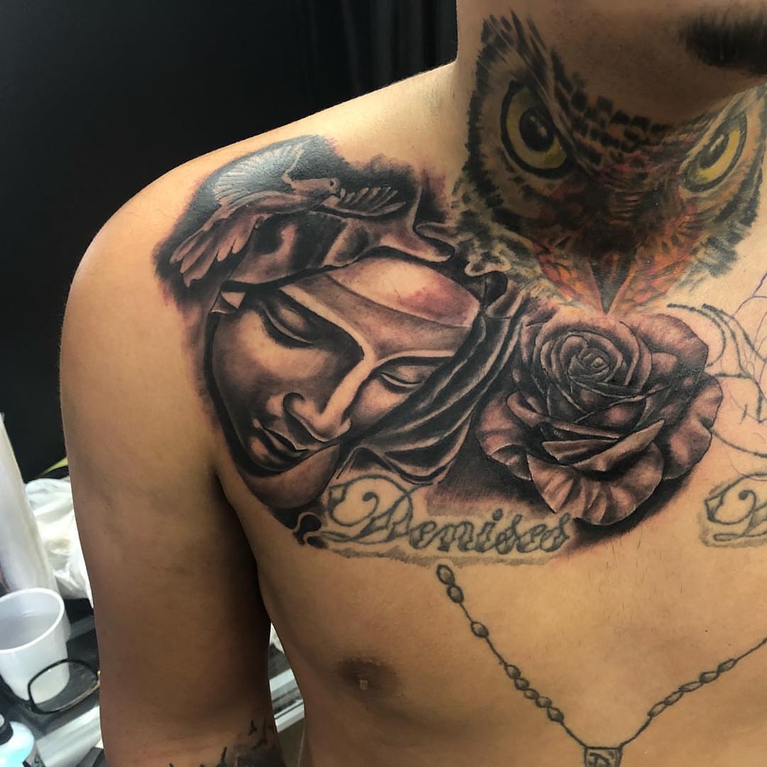 Woman's face with dove and rose realism tattoo on the chest by pecous