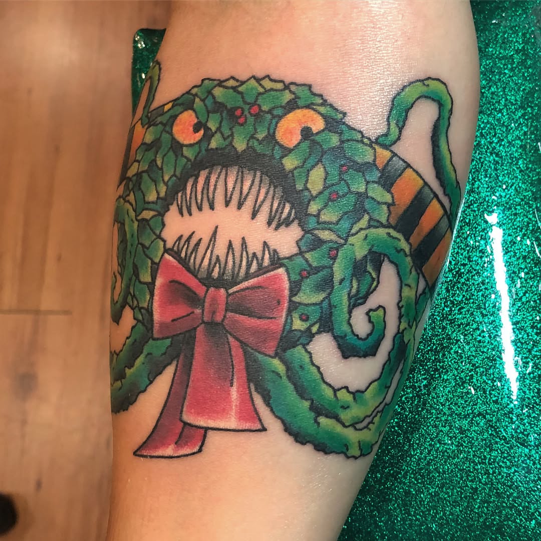 Christmas wreath American traditional tattoo on the forearm by alexandra