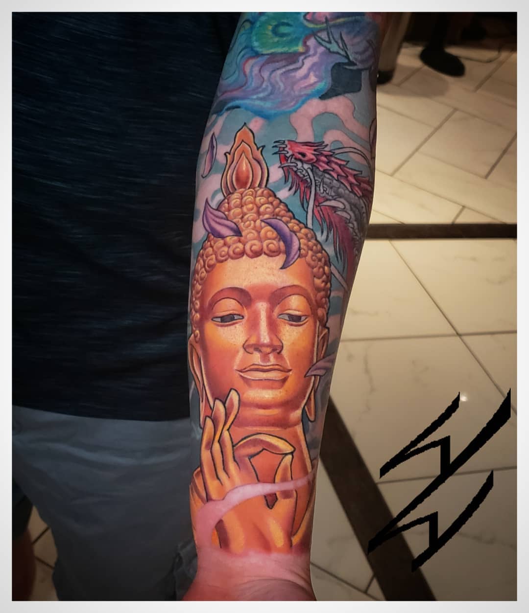 Buddha head realism tattoo on the forearm by Walt Watts, Salt Lake City, Utah