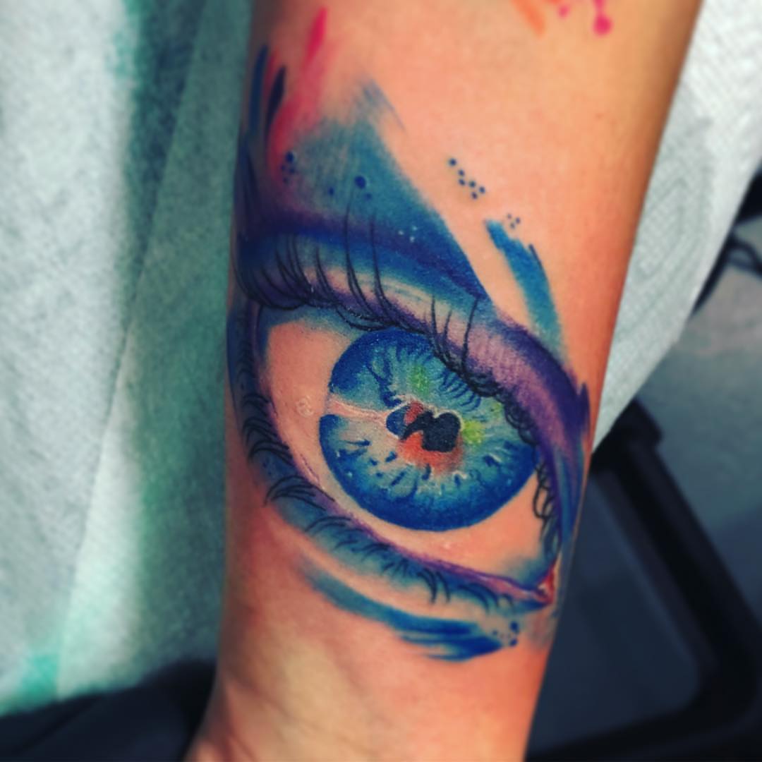 Eye watercolor tattoo on the forearm by El Bryan Tattoos