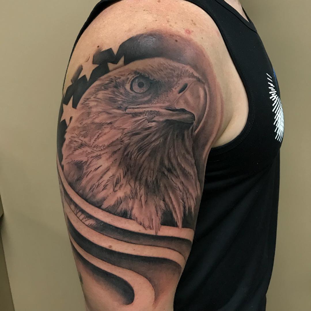 Eagle realism tattoo on the shoulder by Joe Shepp