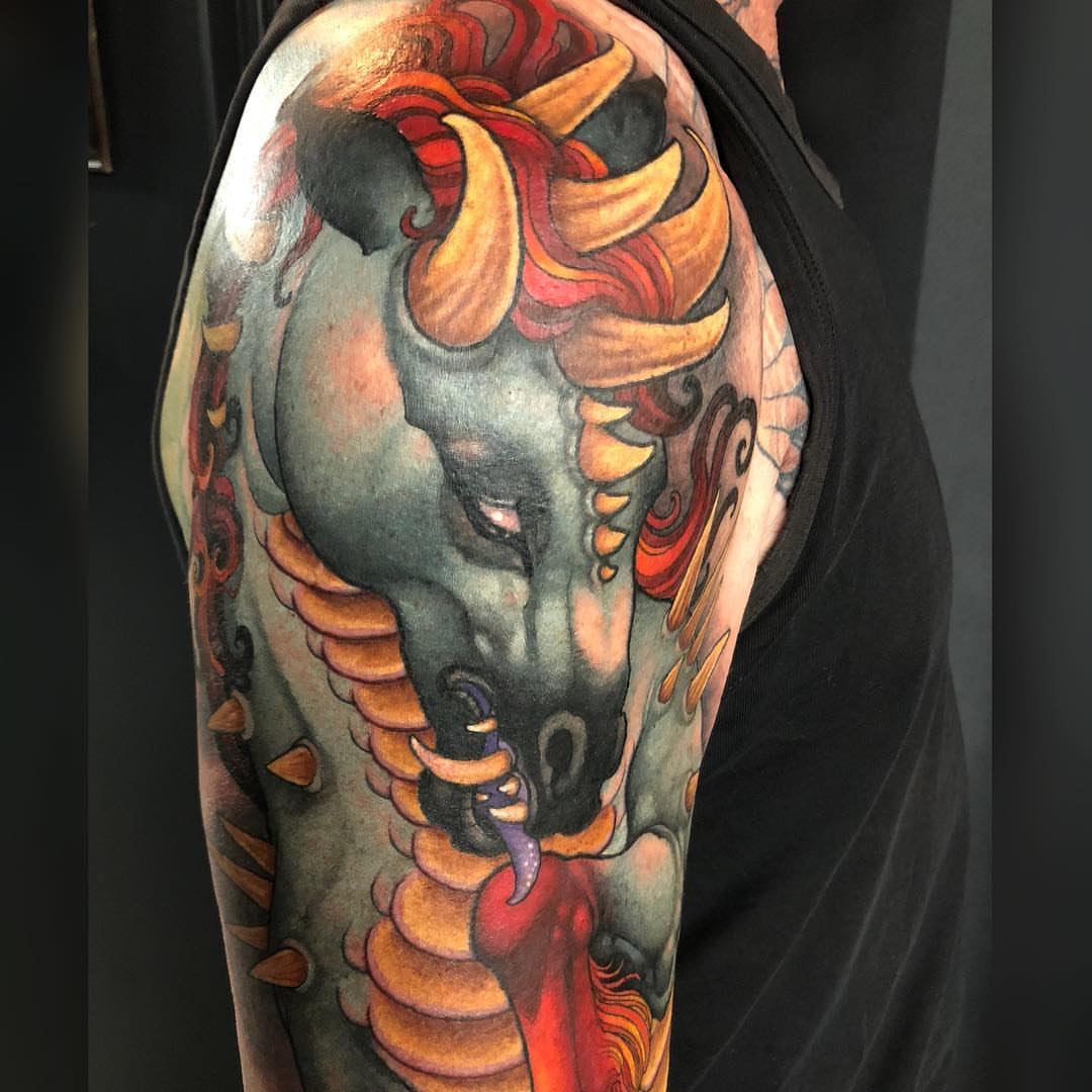 Unicorn realism tattoo on the shoulder by Erin Chance