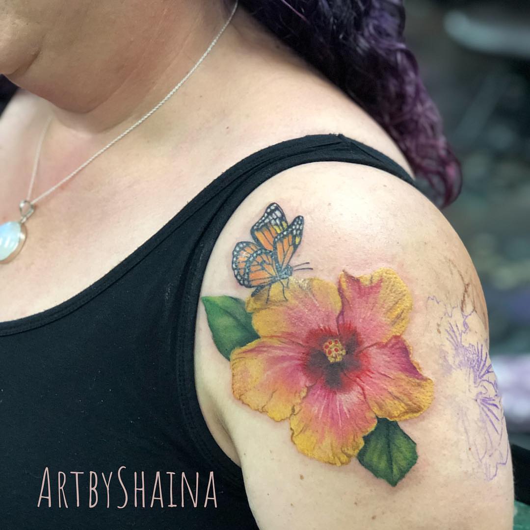 Hibiscus flower and butterfly realism tattoo on the shoulder by ππ·π°πΈπ½π°