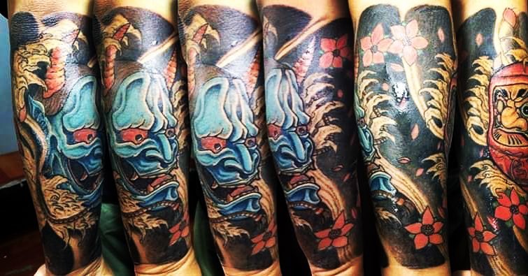 Mask and flowers japanese irezumi tattoo on the forearm by Ferds Villanueva