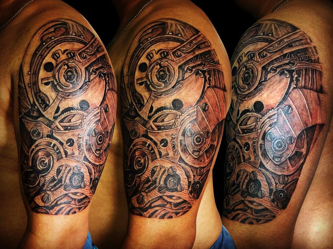 Mechanical gears geometric tattoo on the shoulder by Ferds Villanueva