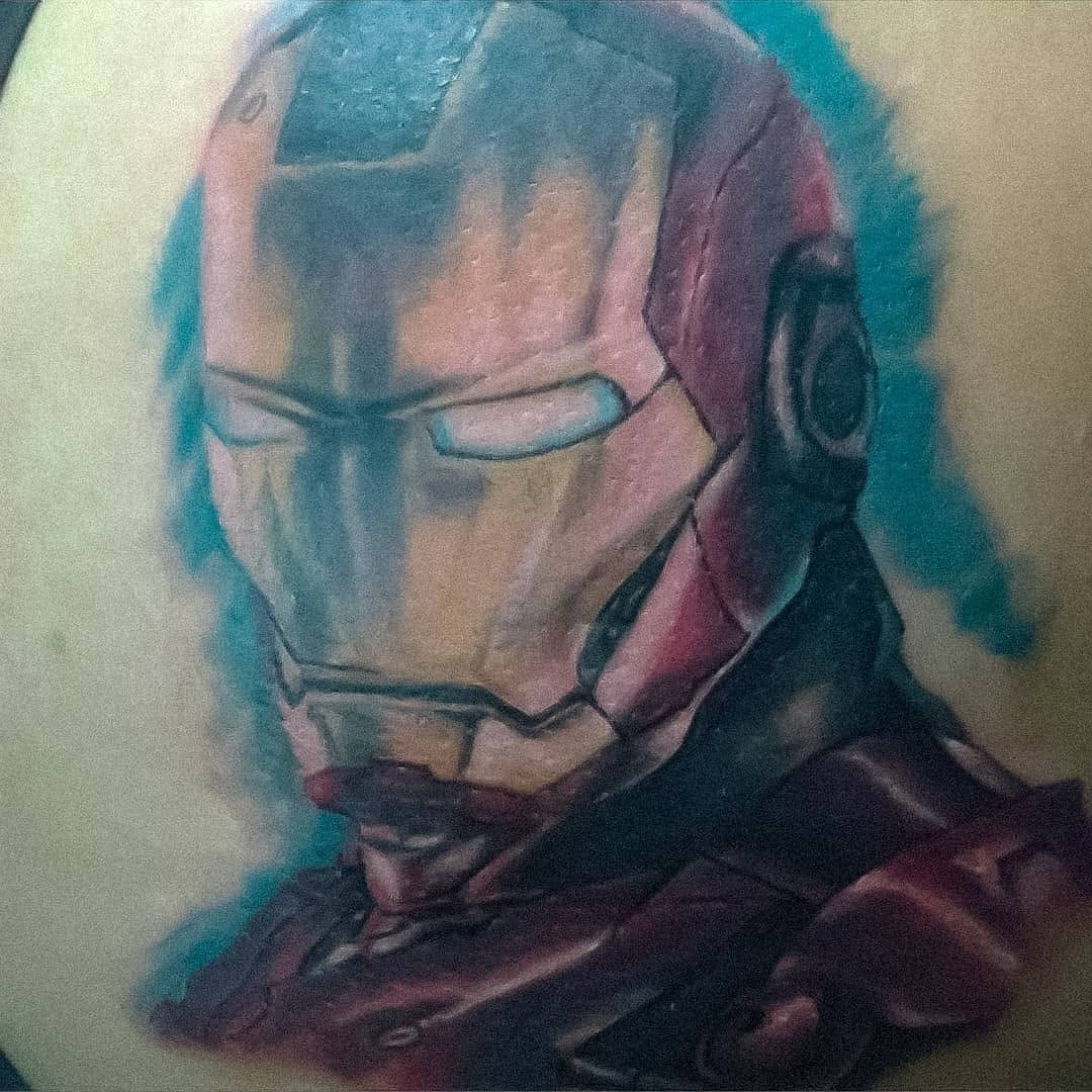 Iron Man helmet tattoo on the torso by 212tattoomalaga, Málaga, Spain