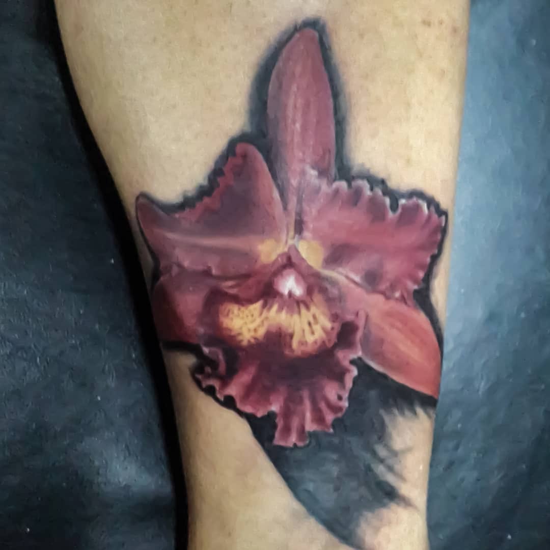 Orchid flower fine line tattoo on the forearm by 212tattoomalaga, Málaga, Spain