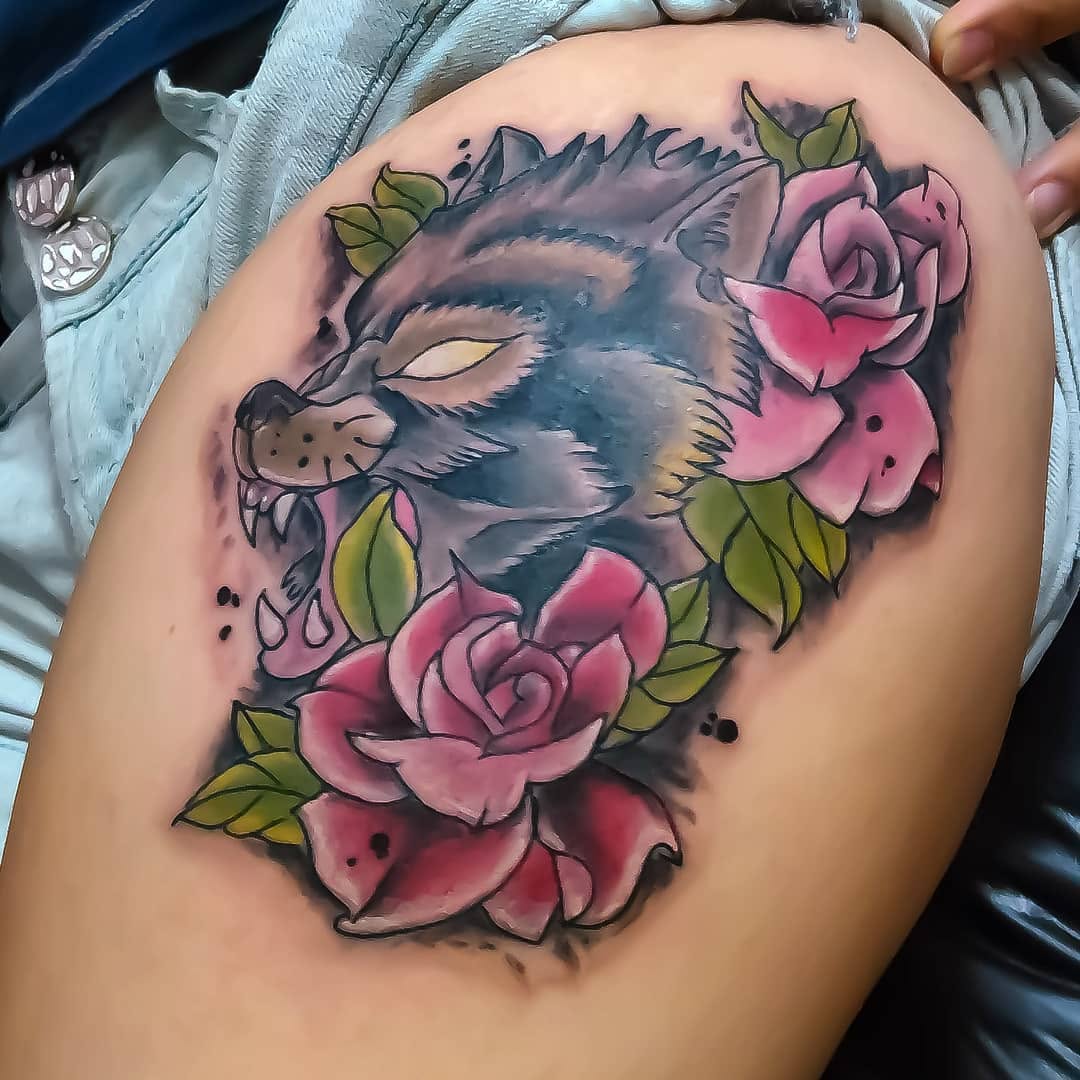Wolf head with roses realism tattoo on the thigh by 212tattoomalaga, Málaga, Spain