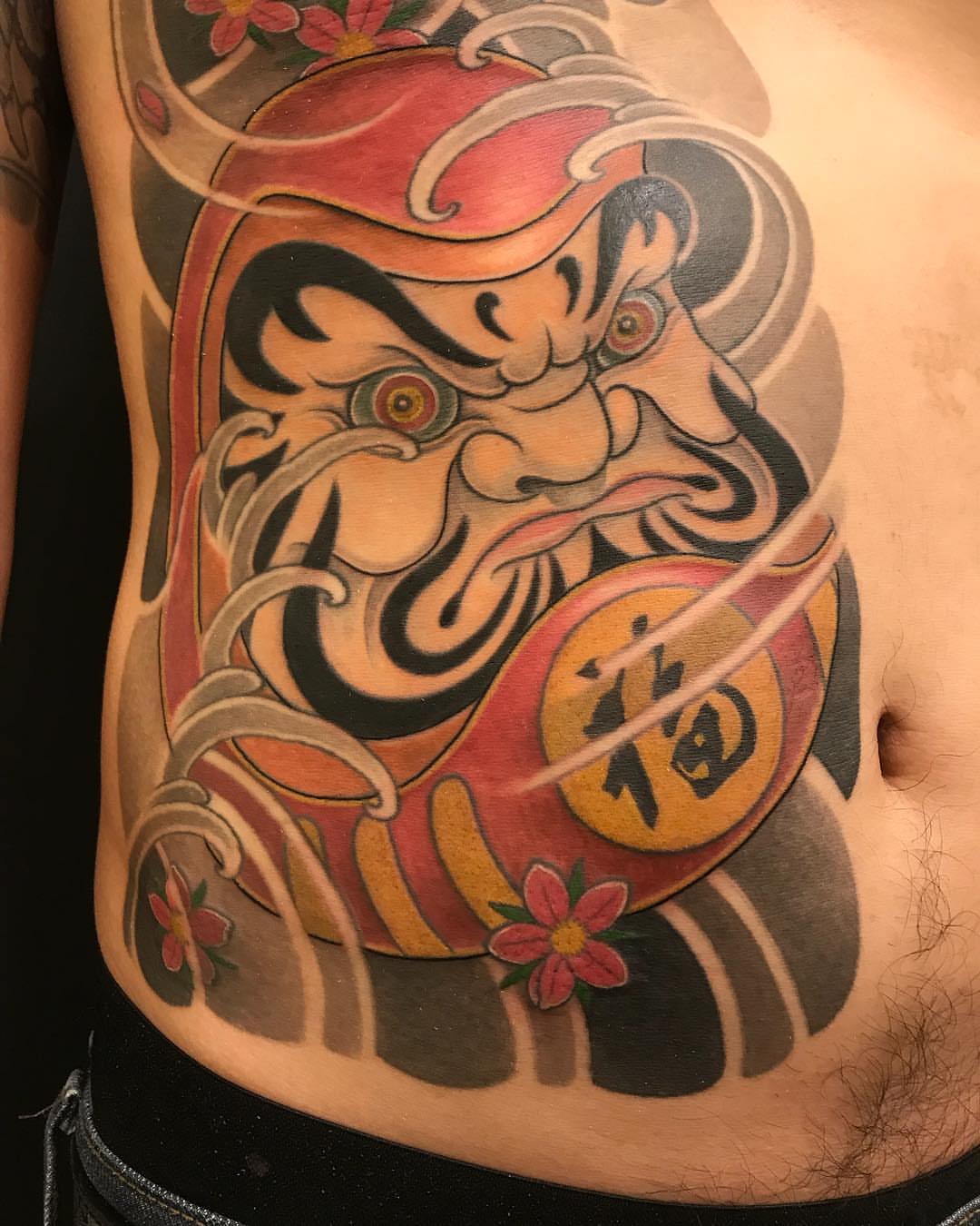 Lion mask japanese irezumi tattoo on the ribs by 重君
