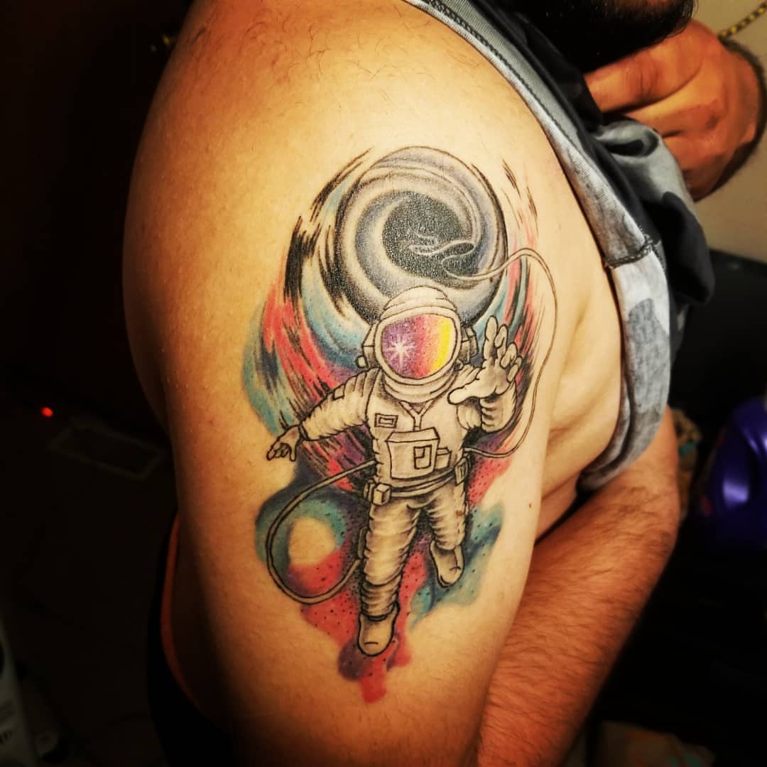 Astronaut dotwork tattoo on the shoulder by André Brazil