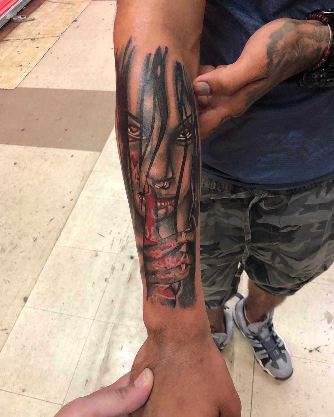 Horror face dark realism tattoo on the forearm by Tattoos By Mauze