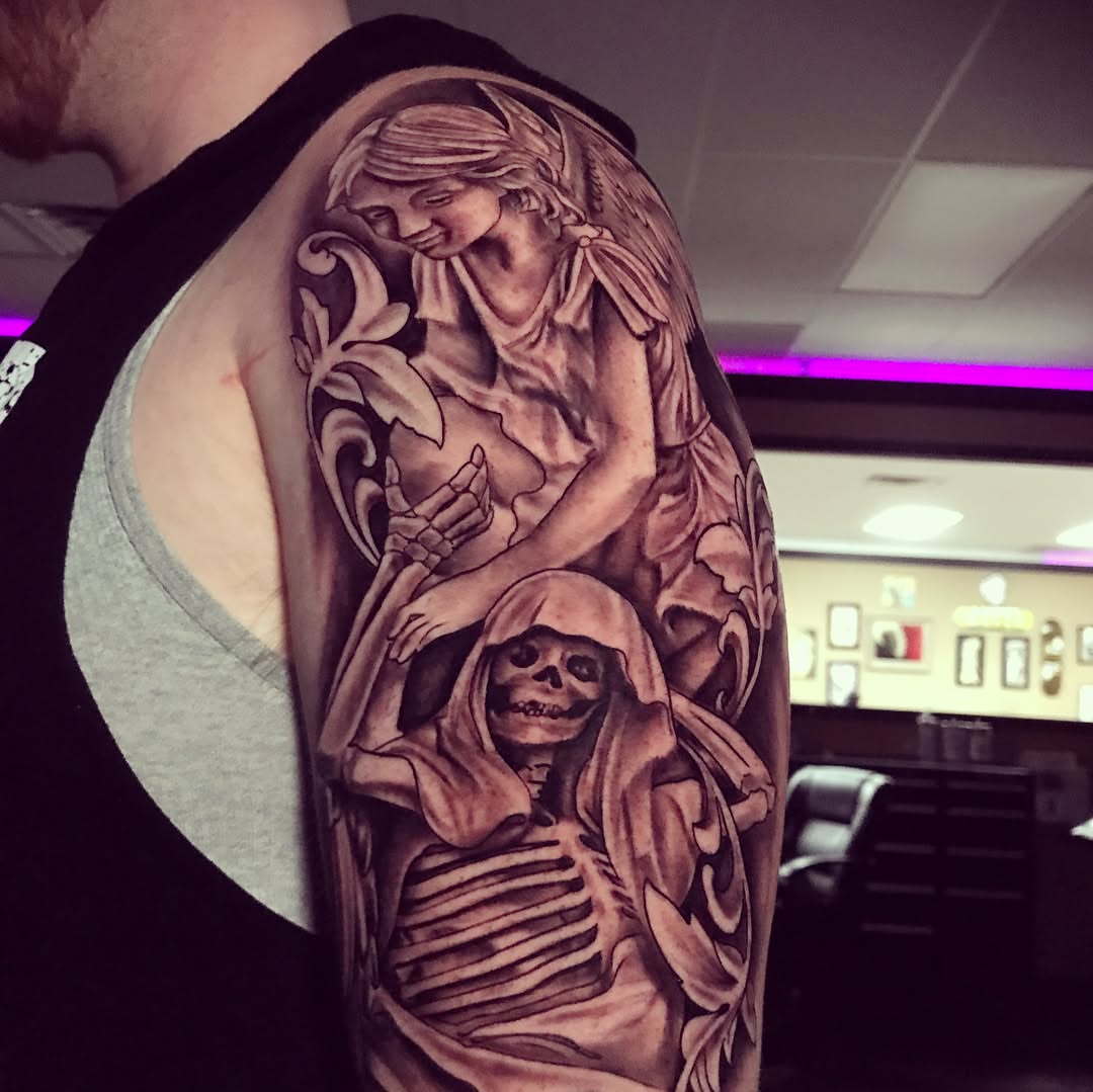 Skeleton and angel realism tattoo on the upper arm by Joe Shepp