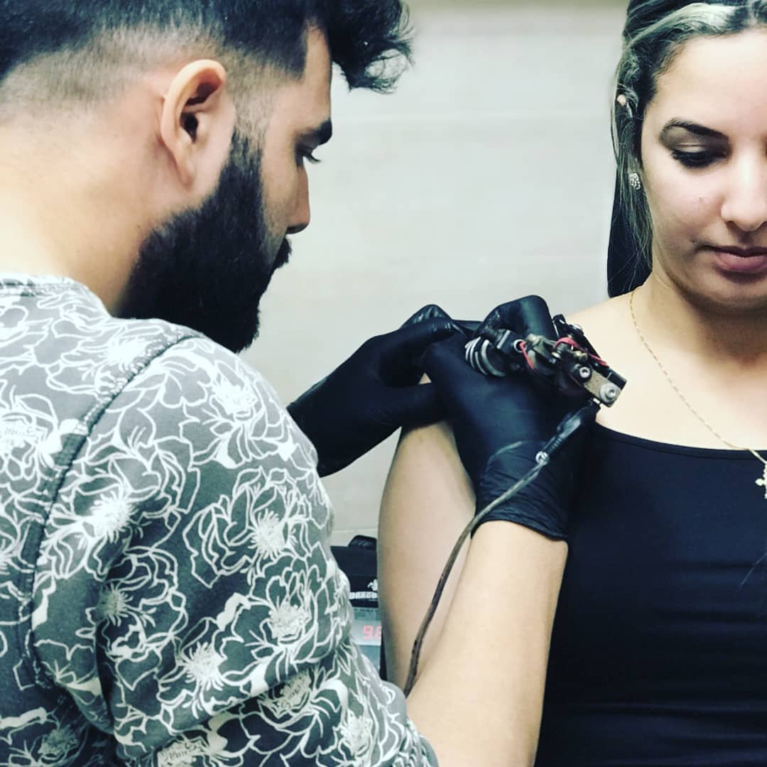 Tattoo artist black and grey tattoo on the upper arm by Luis Manuel Olivera, North Miami, Florida