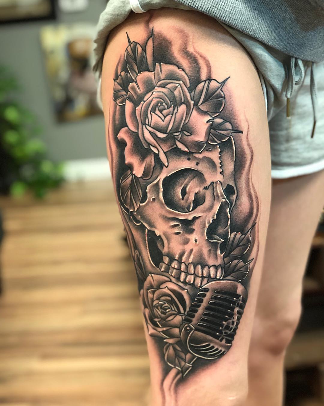 Skull and roses realism tattoo on the thigh by Derek Hutchison, Des Moines, Iowa
