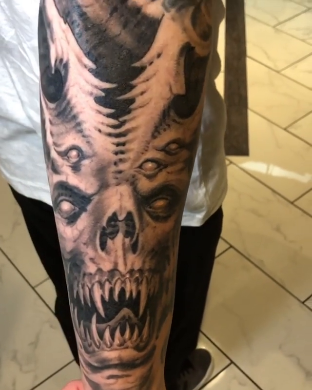 Biomechanical skull and face dark realism tattoo by Oak Adams