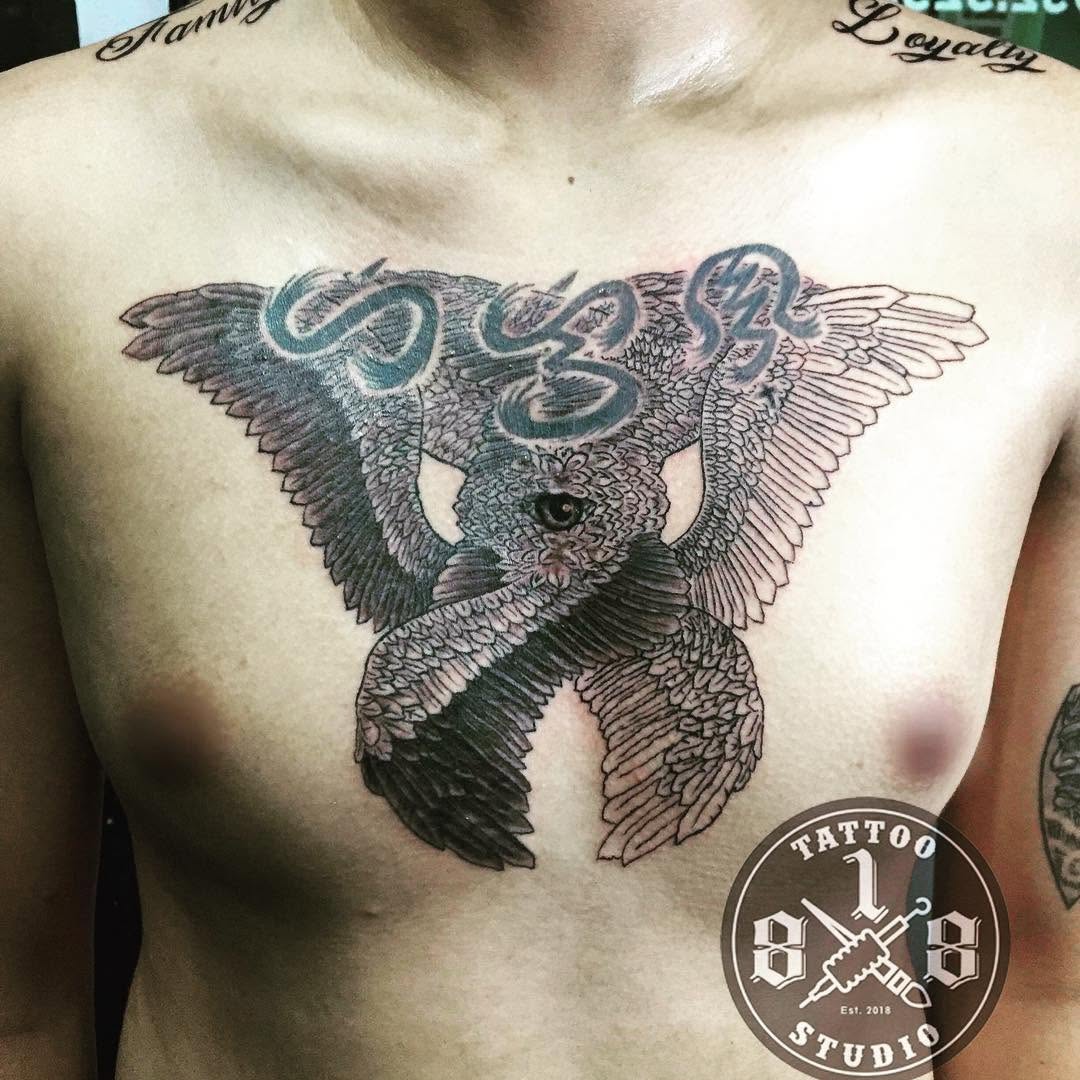 Owl with wings and text tattoo on the chest by Ferds Villanueva