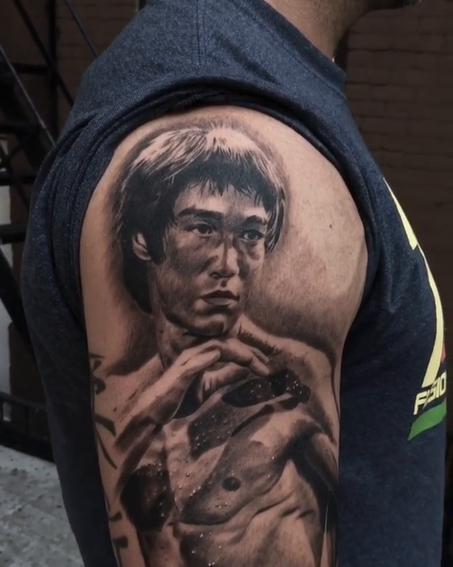 Bruce Lee portrait realism tattoo by Carlos Macedo Tattoo