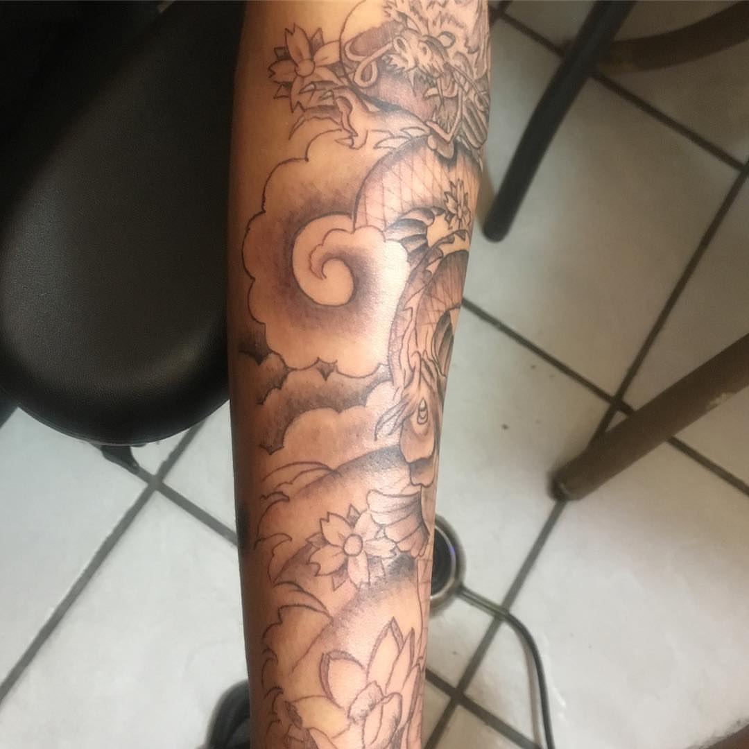 Dragon and clouds japanese irezumi tattoo on the forearm by Junior Trevino