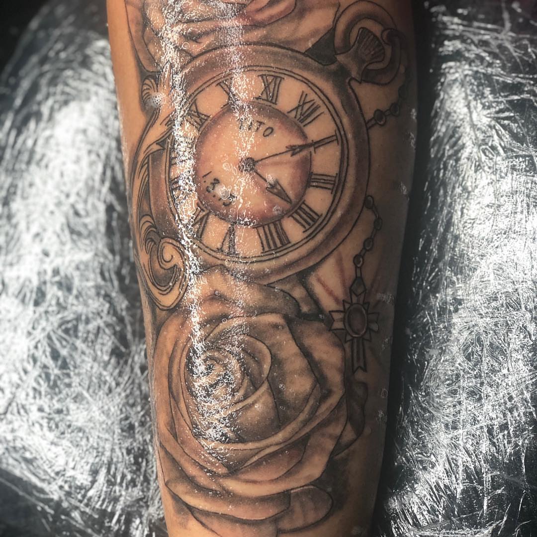 Clock and rose realism tattoo on the forearm by Nj Tattoo Artist Inkdyou, Bloomfield, New Jersey