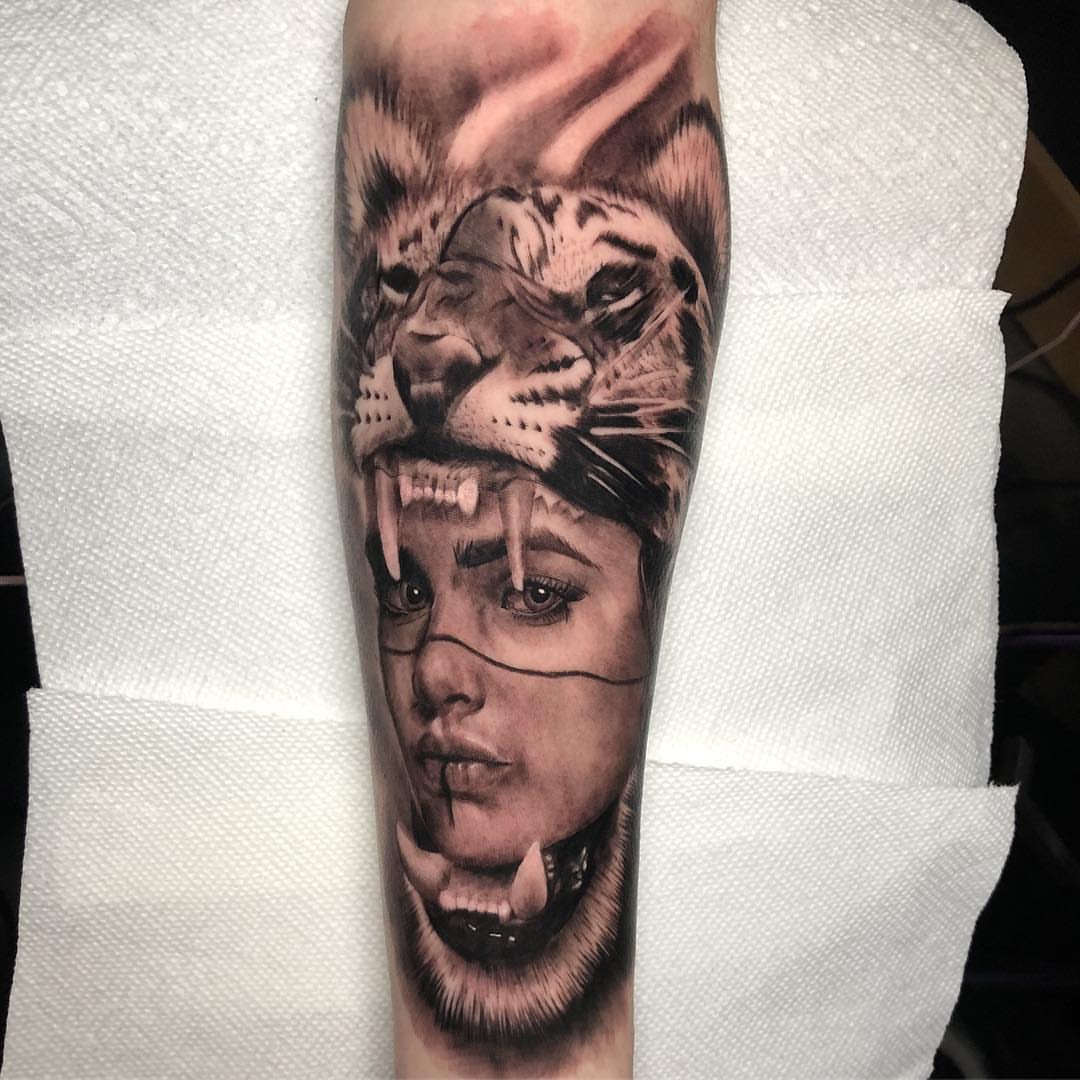 Woman with lion realism tattoo on the forearm by Dalton King Pensacola Tattooer