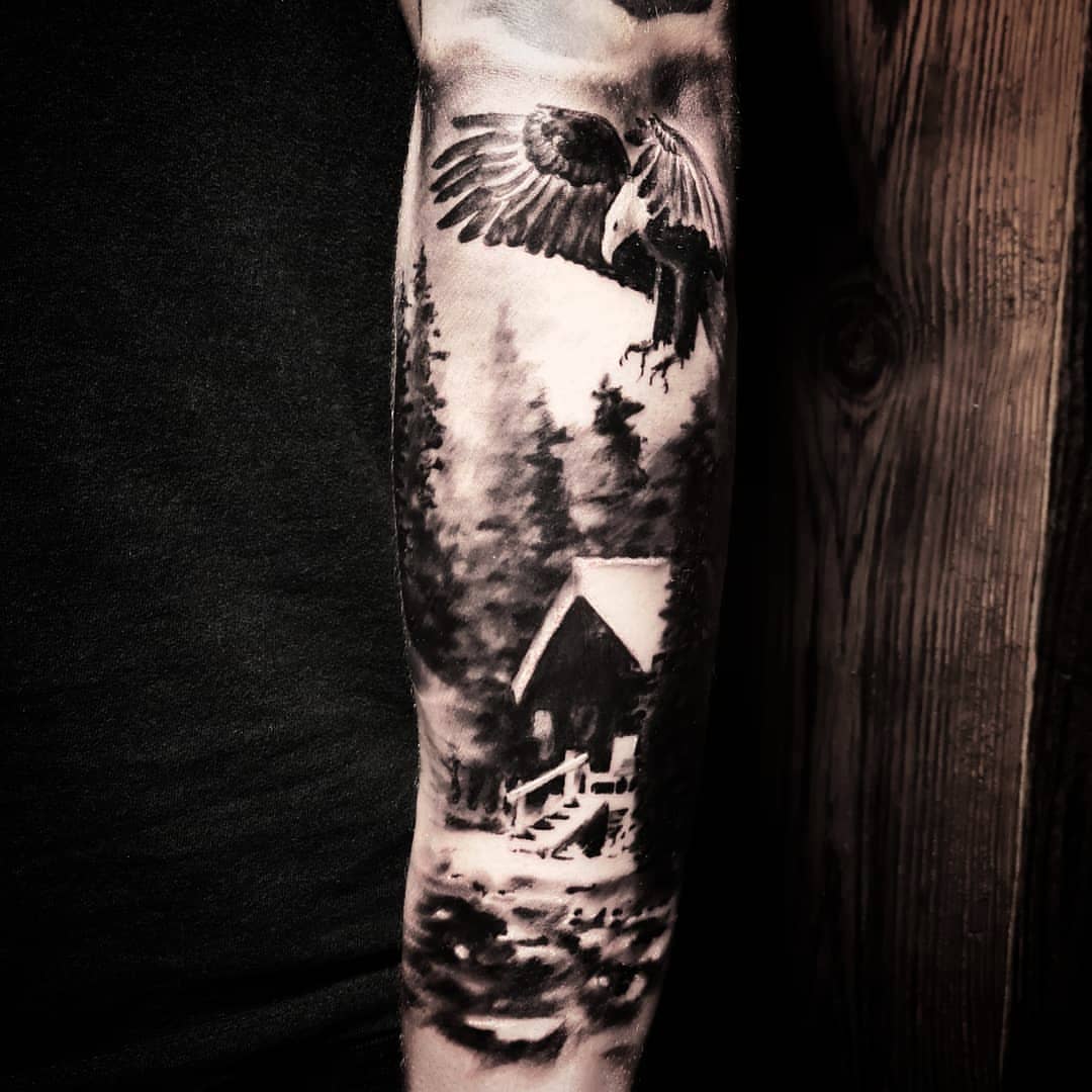 Eagle and cabin realism tattoo on the forearm by Lindsay
