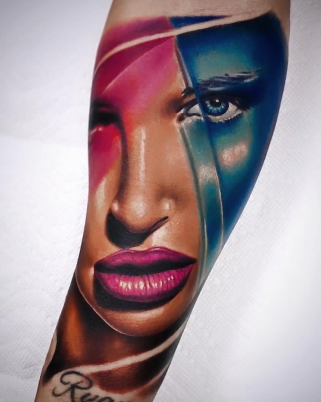 Abstract face realism tattoo on the forearm by Dayron Gonzalez
