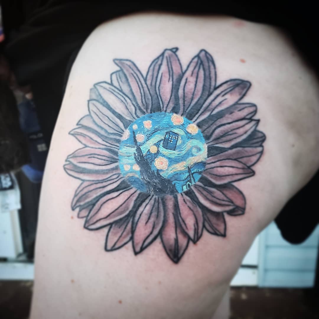 Sunflower dotwork tattoo on the thigh by Kayla Linton