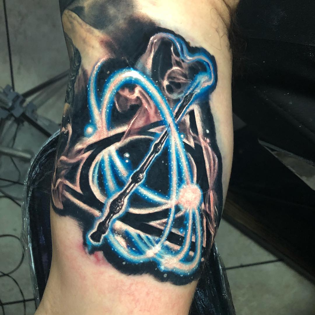 Atomic structure dotwork tattoo on the forearm by Mike Shultz