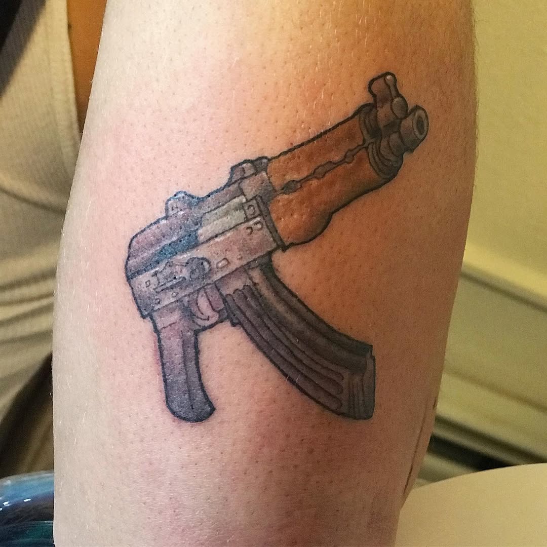 AK-47 rifle realism tattoo on the forearm by Chris