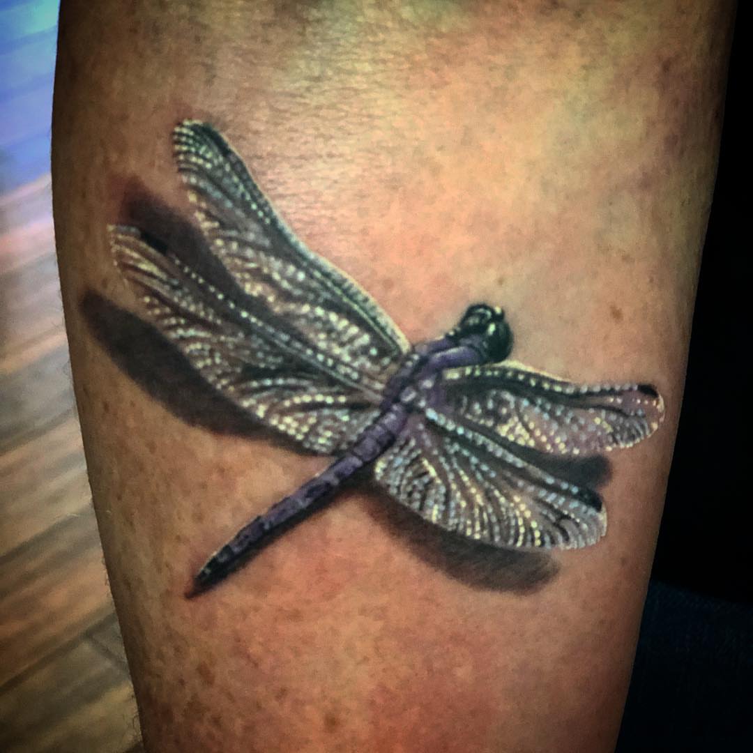 Dragonfly realism tattoo on the forearm by Jared Ammons