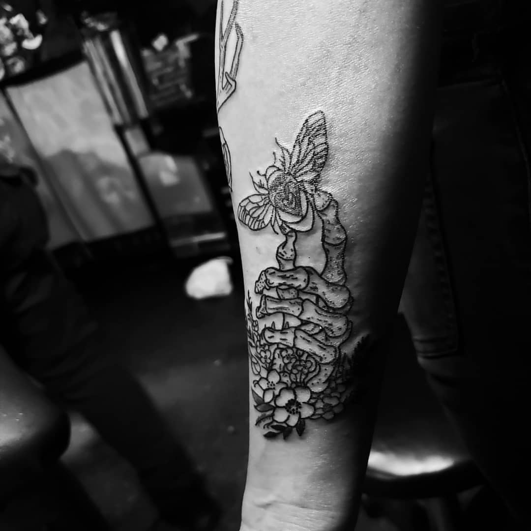 Butterfly and flowers black and grey tattoo on the forearm by Eddy