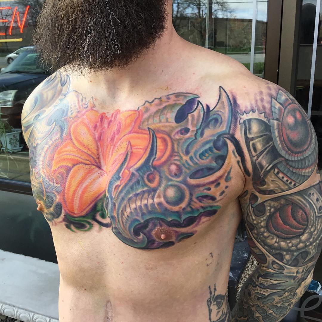 Floral dragon dotwork tattoo on the back by Phil Robertson